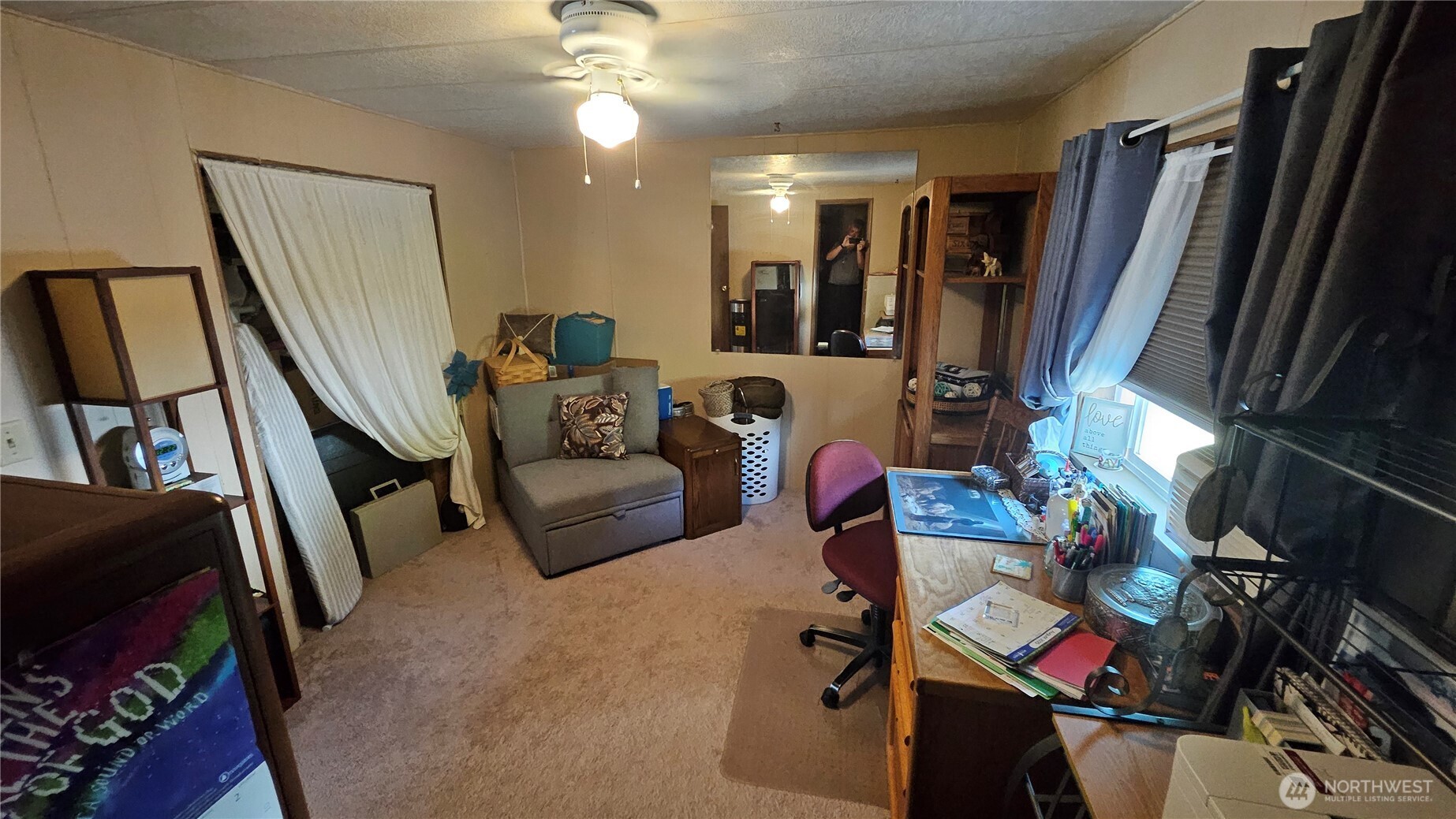 5600 Mt Solo Road, Unit 161 Longview, WA 98632 - Photo 8 of 17 a living room with furniture and a flat screen tv