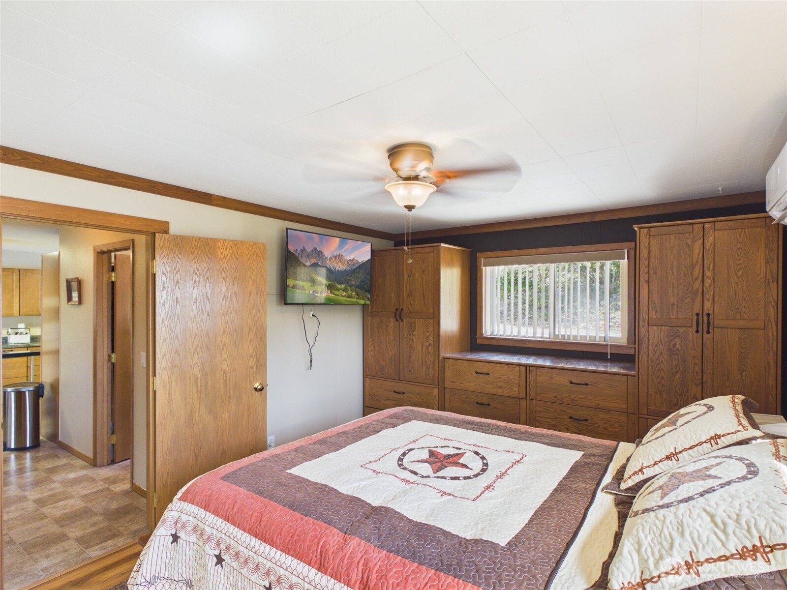 6 Marions Cove Road Republic, WA 99166 - Photo 10 of 33 a bedroom that has a bed and a chandelier