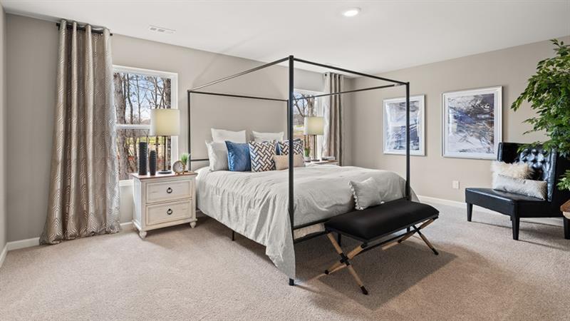 74 Buckthorn Way Dallas, GA 30132 - Photo 15 of 37 a bed room with a bed and a couch