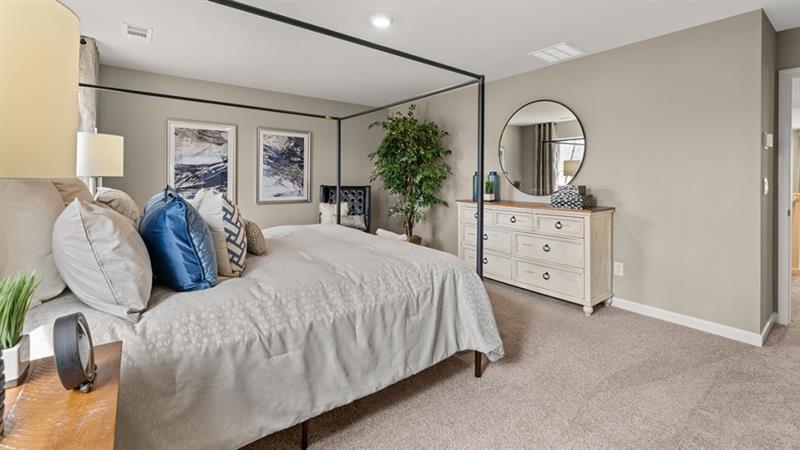 74 Buckthorn Way Dallas, GA 30132 - Photo 16 of 37 a bedroom with a bed and a dresser