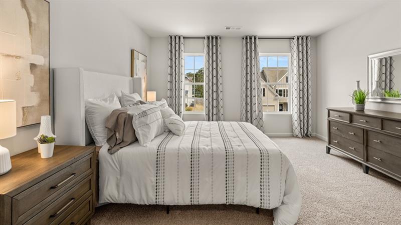 74 Buckthorn Way Dallas, GA 30132 - Photo 27 of 37 a bedroom with a bed and a dresser