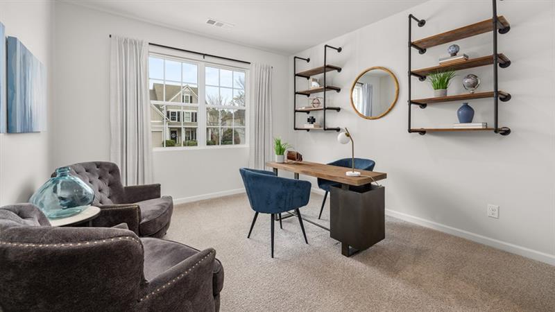 74 Buckthorn Way Dallas, GA 30132 - Photo 30 of 37 a living room with furniture a window and a chair