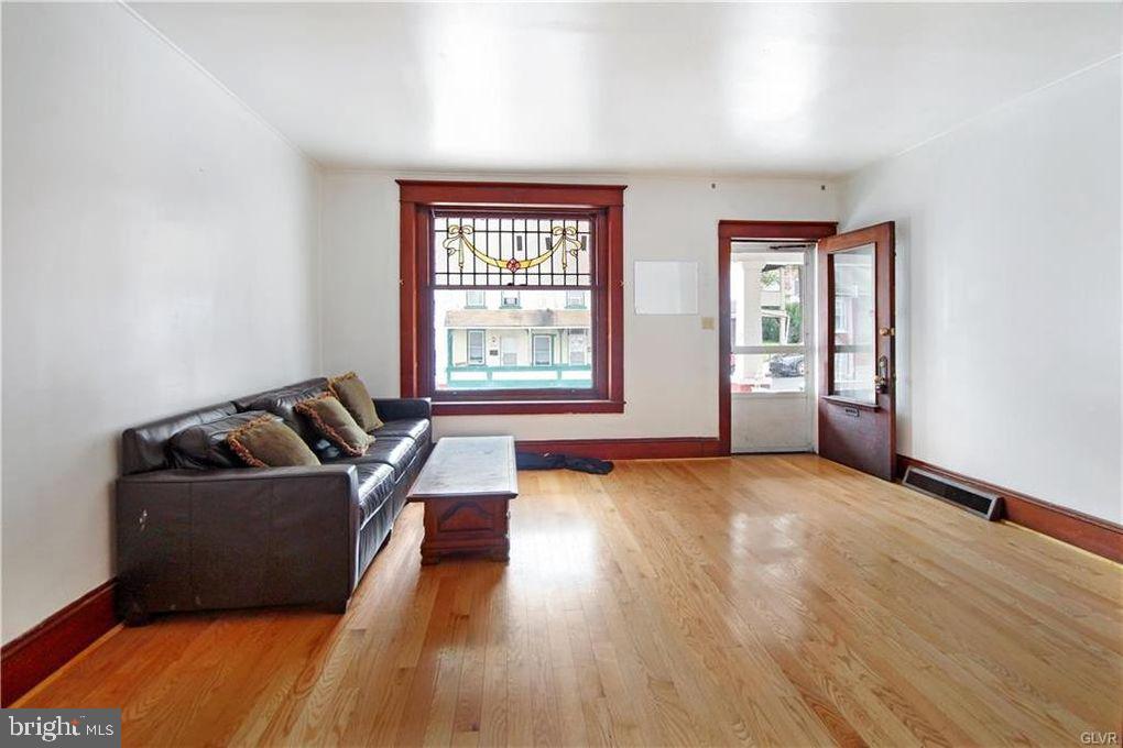 516 Carlton Avenue Bethlehem, PA 18015 - Photo 2 of 12 a living room with furniture and a window