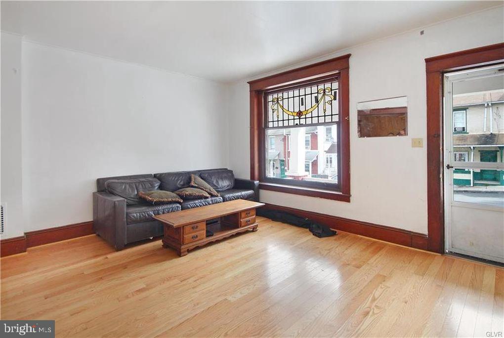 516 Carlton Avenue Bethlehem, PA 18015 - Photo 3 of 12 a living room with furniture and windows