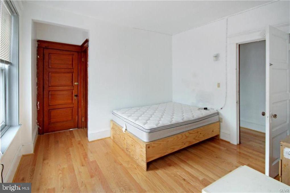 516 Carlton Avenue Bethlehem, PA 18015 - Photo 6 of 12 a bedroom with a bed and a dresser