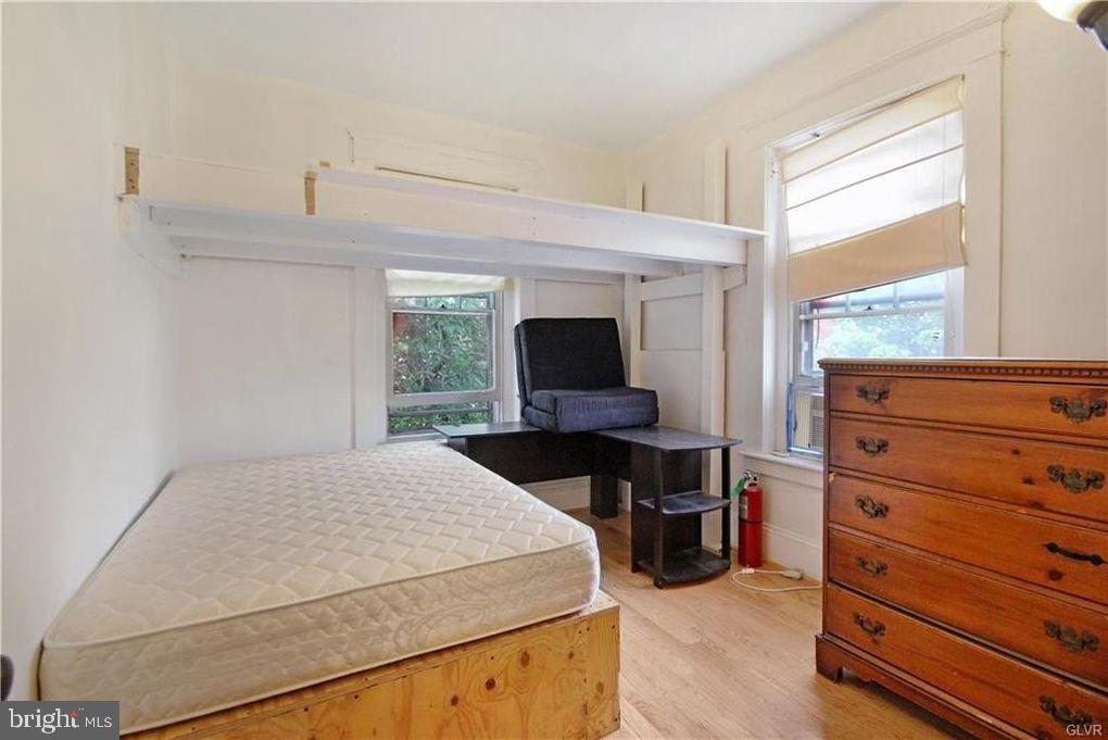 516 Carlton Avenue Bethlehem, PA 18015 - Photo 7 of 12 a bedroom with a bed and a window