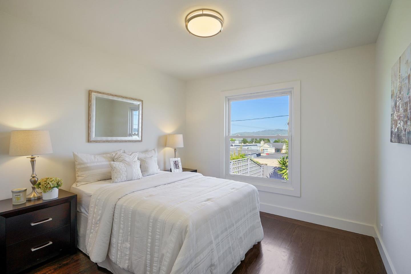 147 Morningside Drive Daly City, CA 94015 - Photo 17 of 29 a bedroom with a bed and a window