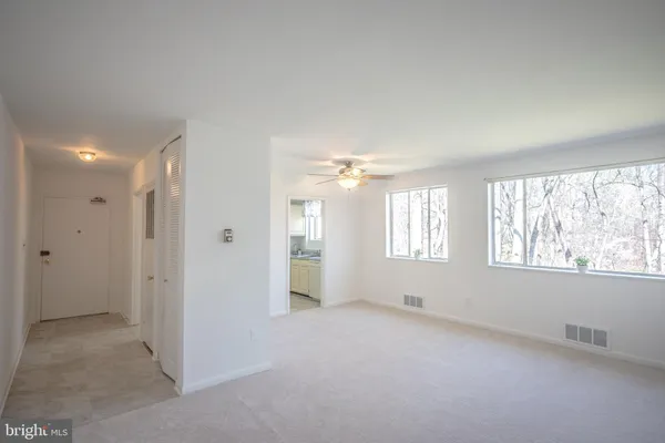 a view of an empty room with a window