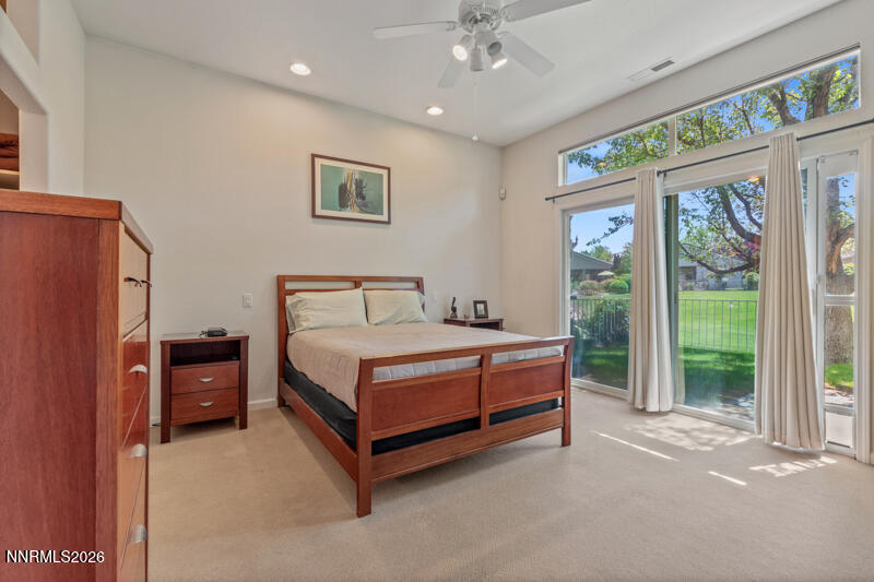 403 Sierra Leaf Circle Reno, NV 89511 - Photo 13 of 25 a bedroom with a bed and a large window
