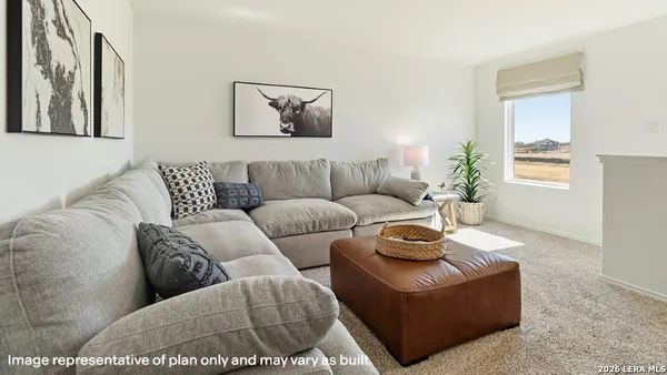 a living room with furniture and a window