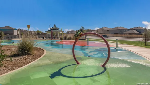 a swimming pool with barbeque oven