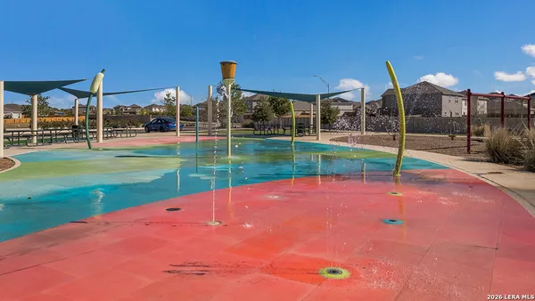 a view of a backyard with sitting area