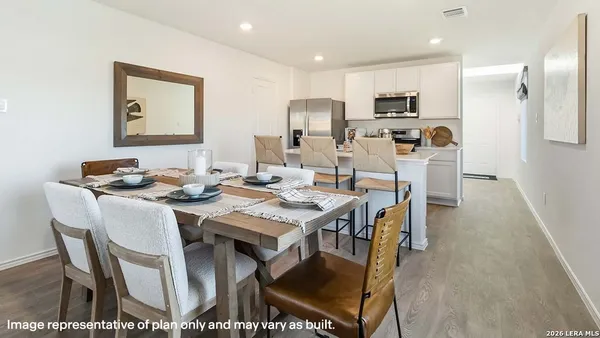 a view of a dining room with furniture