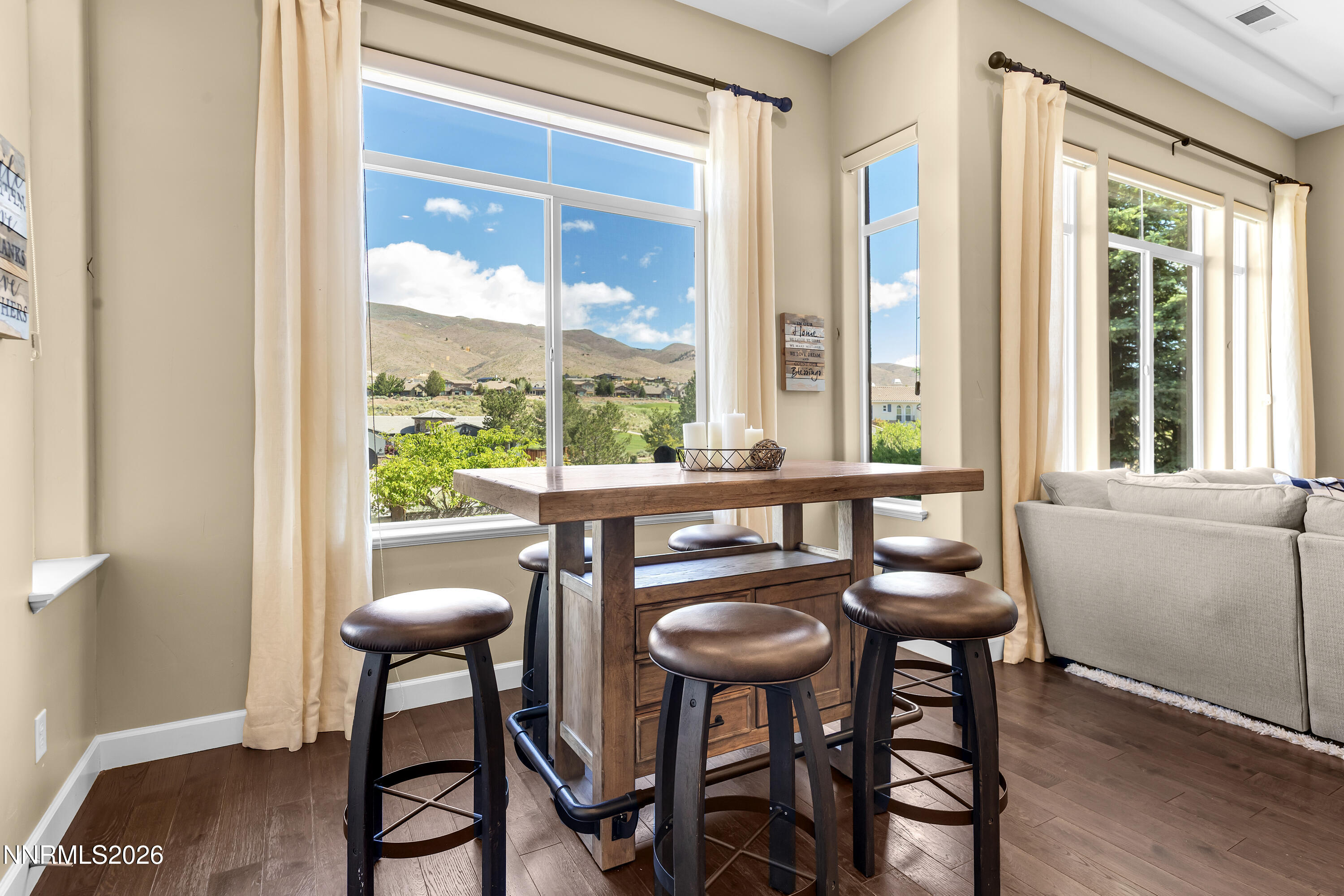 1898 Laurel Ridge Drive Reno, NV 89523 - Photo 26 of 87 a dining room with furniture a chandelier and wooden floor