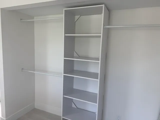 a view of an empty walk in closet