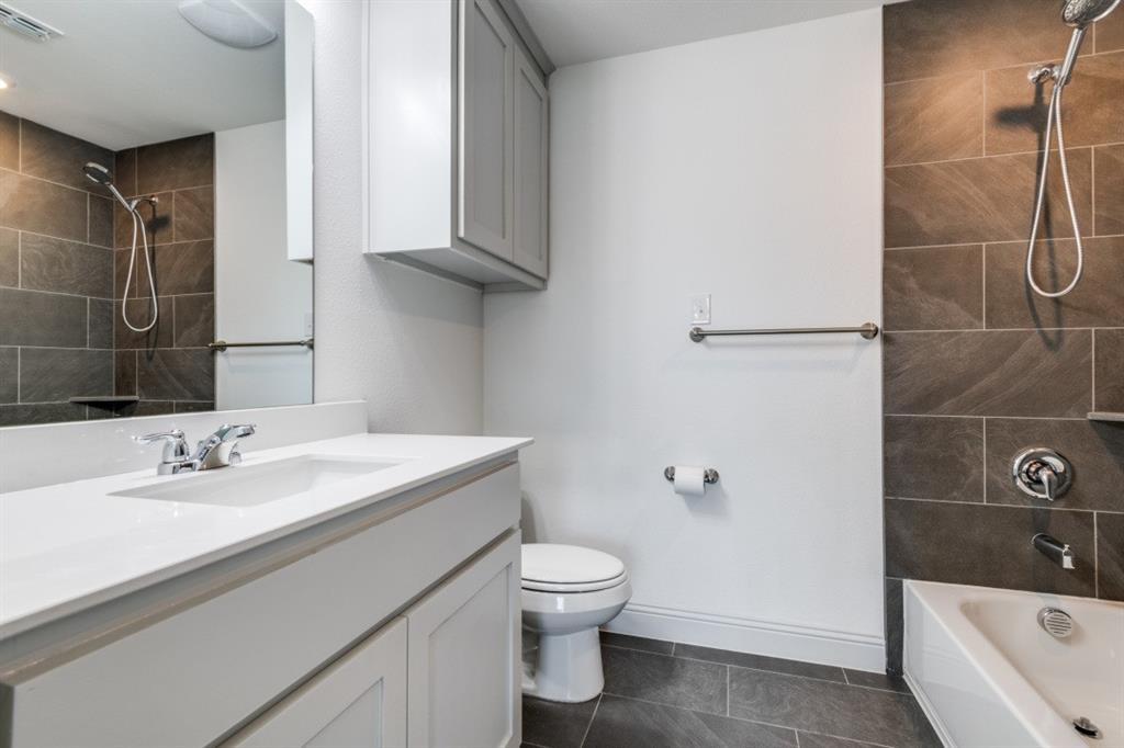 332 Braves Way Lavon, TX 75166 - Photo 19 of 24 a bathroom with a sink a toilet and shower