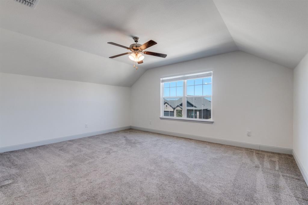 332 Braves Way Lavon, TX 75166 - Photo 21 of 24 an empty room with a window and a ceiling fan
