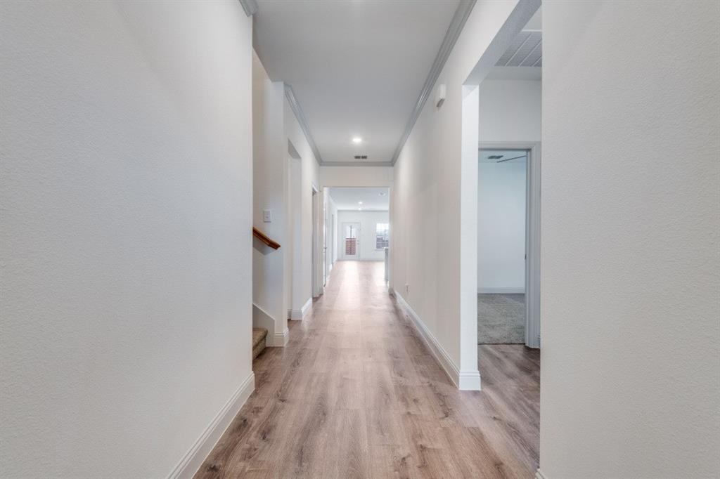 332 Braves Way Lavon, TX 75166 - Photo 3 of 24 a view of a hallway with wooden floor