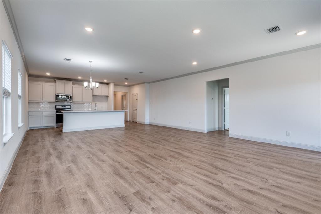 332 Braves Way Lavon, TX 75166 - Photo 7 of 24 a view of empty room with wooden floor