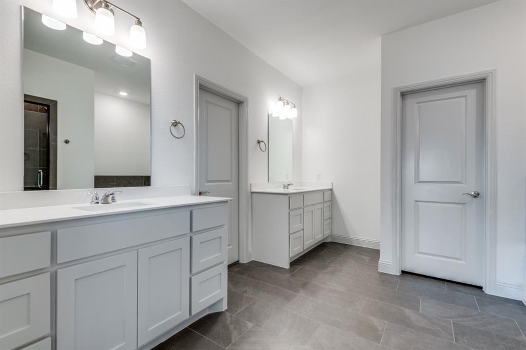 332 Braves Way Lavon, TX 75166 - Photo 10 of 24 a bathroom with double vanity sink and mirror