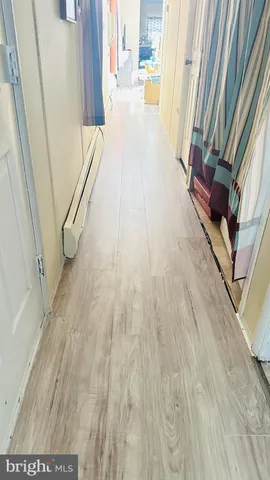 a hallway with wooden floor
