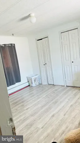a view of wooden floor and staircase in a room