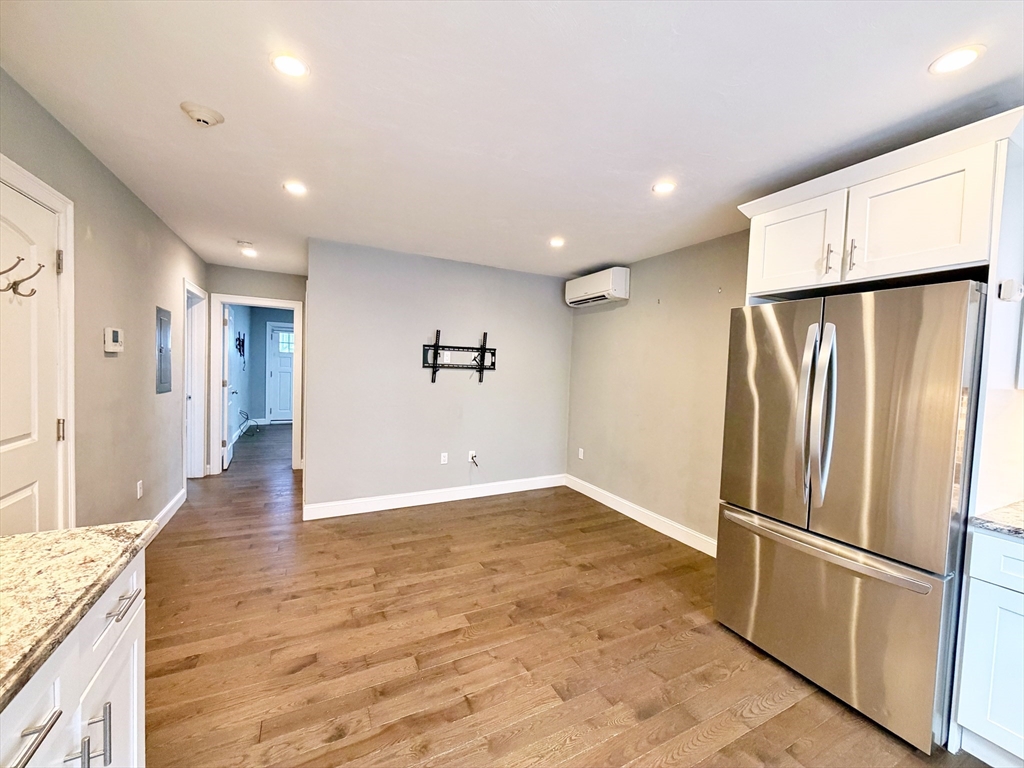 266 Lexington Street, Unit 1 Boston, MA 02128 - Photo 10 of 19 a view of a kitchen with a refrigerator and a stove top oven