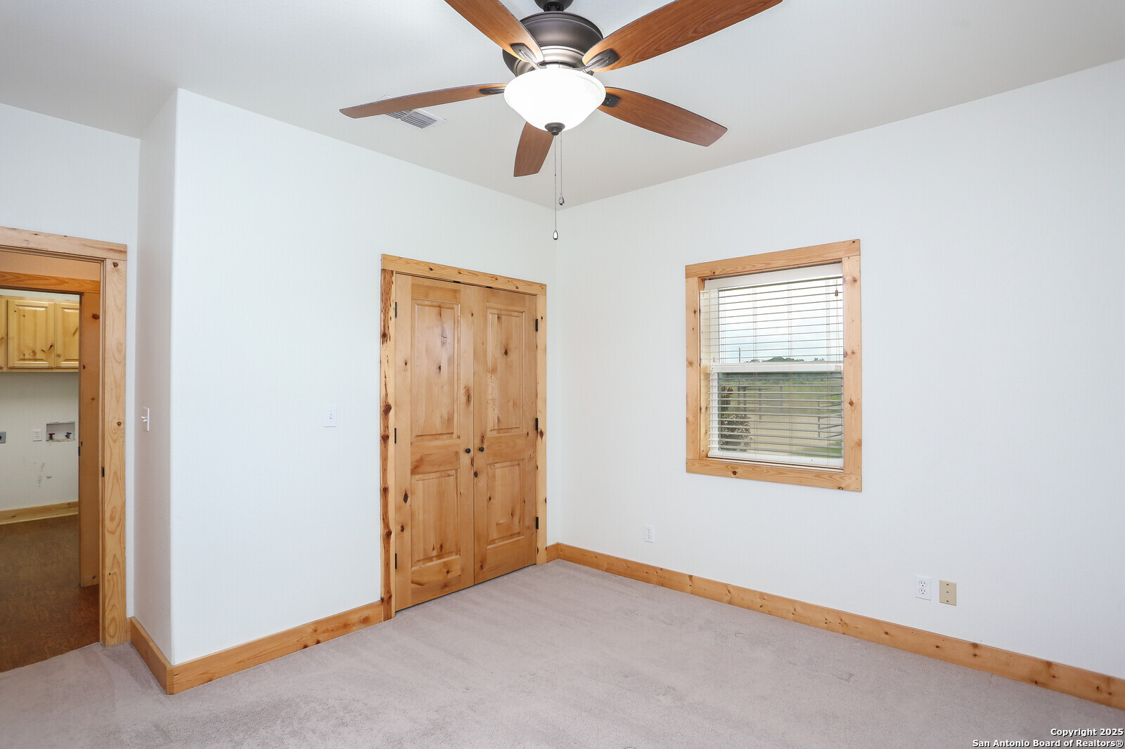 891 Hopkinsville Road Cuero, TX 77954 - Photo 14 of 36 an empty room with windows and fan