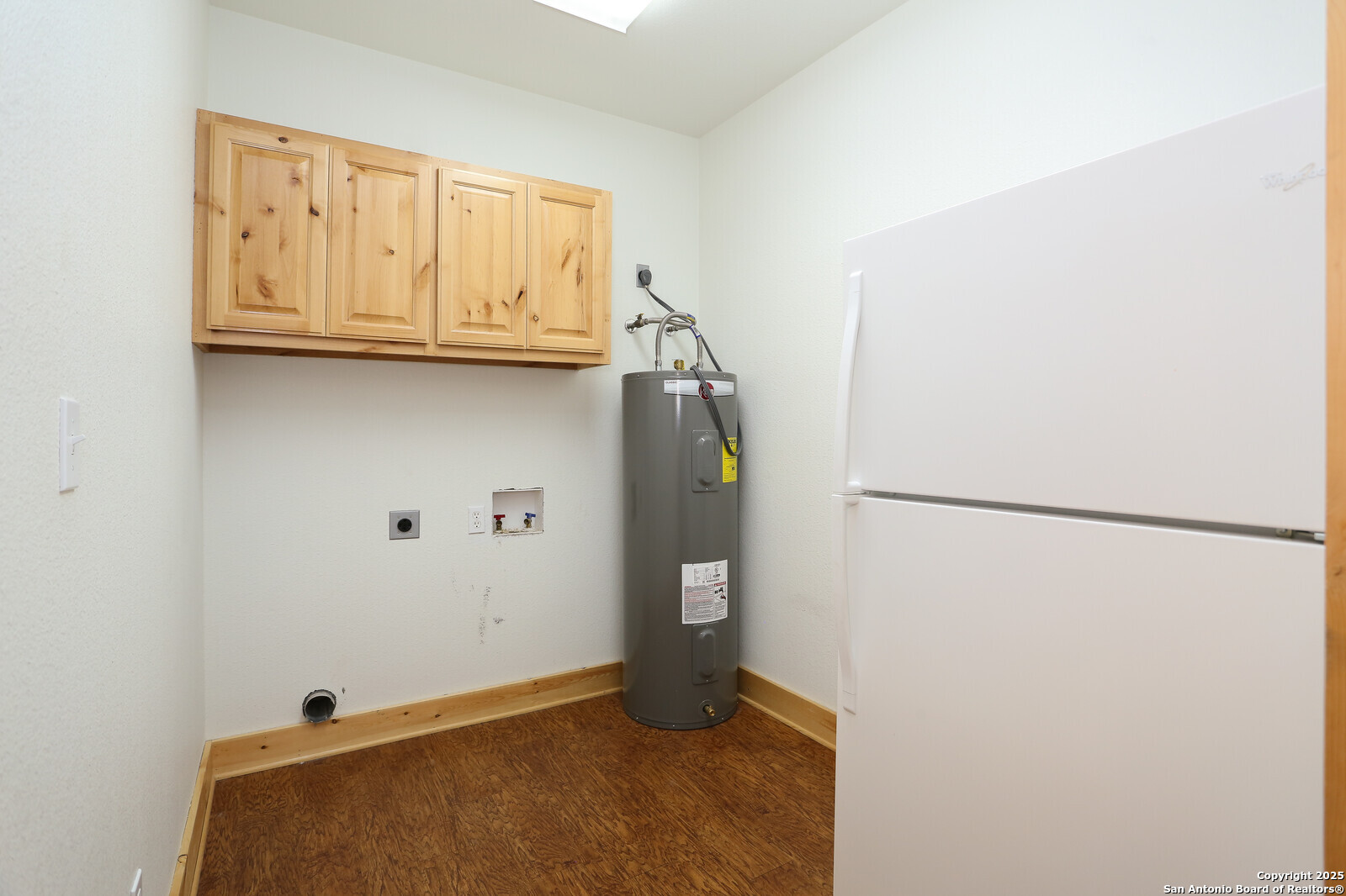891 Hopkinsville Road Cuero, TX 77954 - Photo 20 of 36 a view of storage and utility room with refrigerator