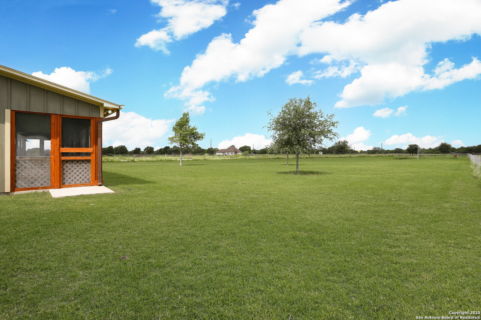 891 Hopkinsville Road Cuero, TX 77954 - Photo 2 of 36 a view of an ocean with a building in the background