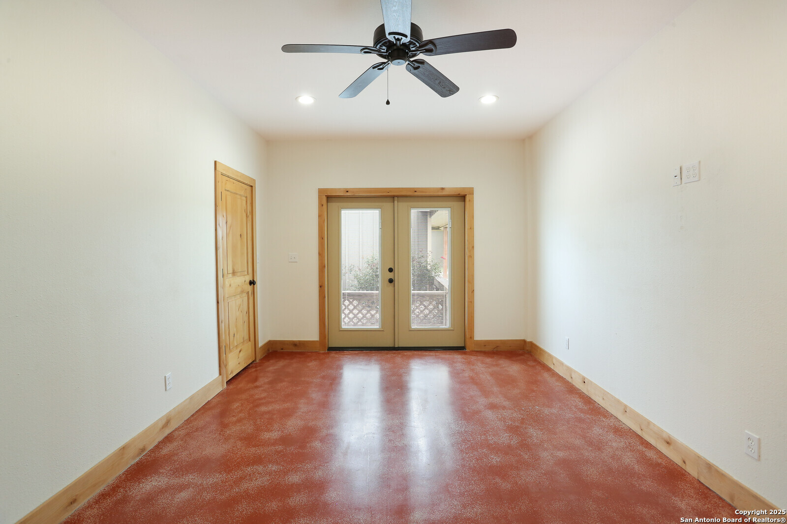 891 Hopkinsville Road Cuero, TX 77954 - Photo 26 of 36 wooden floor in an empty room with a window