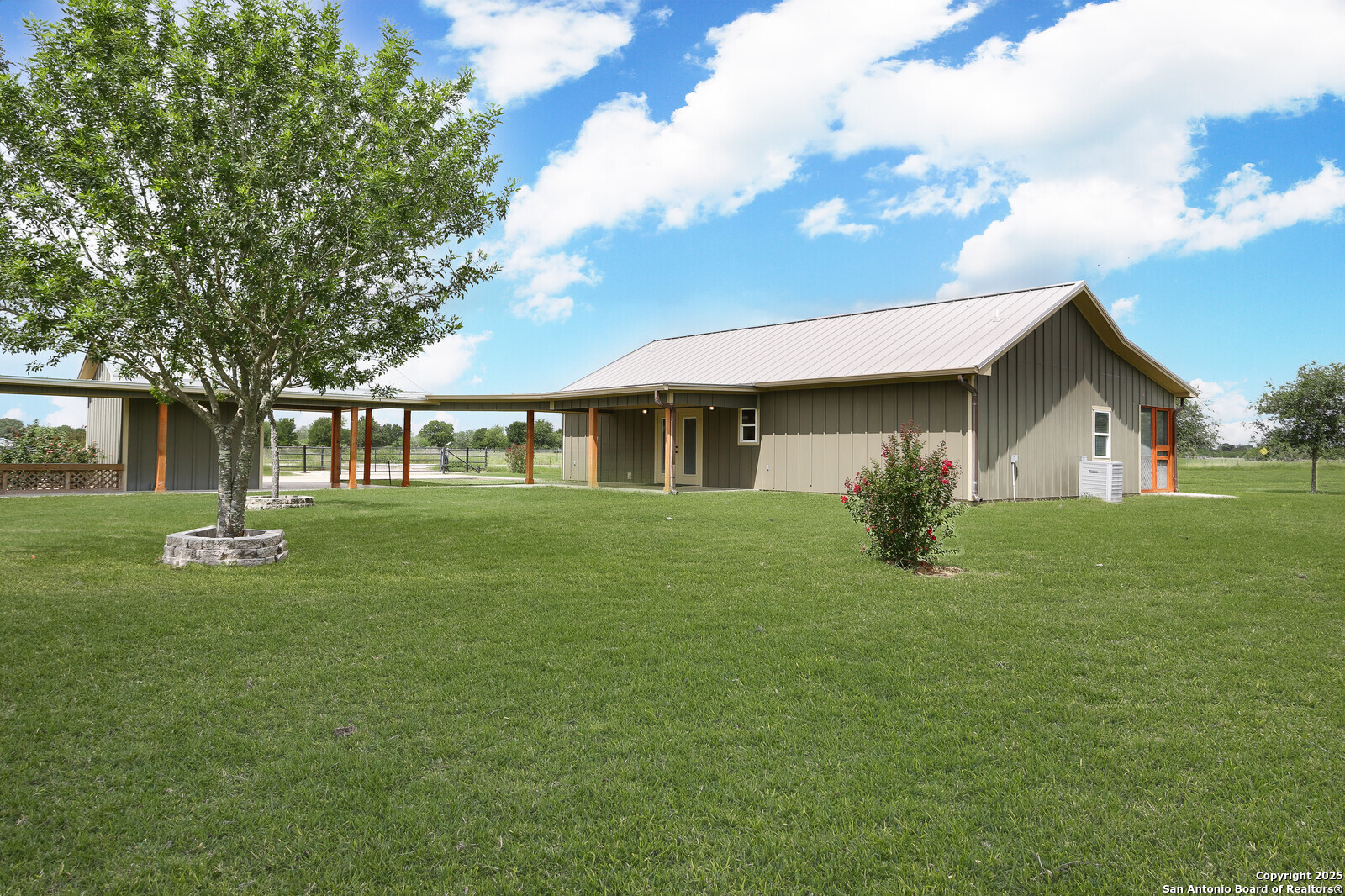 891 Hopkinsville Road Cuero, TX 77954 - Photo 29 of 36 a front view of a house with a garden
