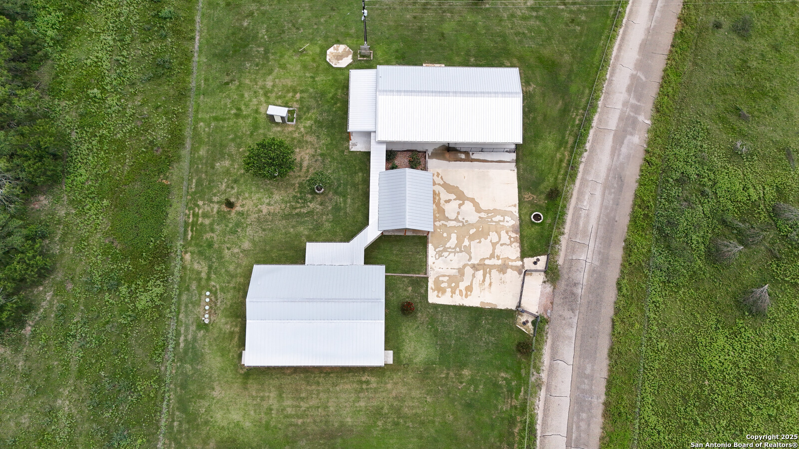 891 Hopkinsville Road Cuero, TX 77954 - Photo 35 of 36 a aerial view of a house with pool yard and outdoor seating