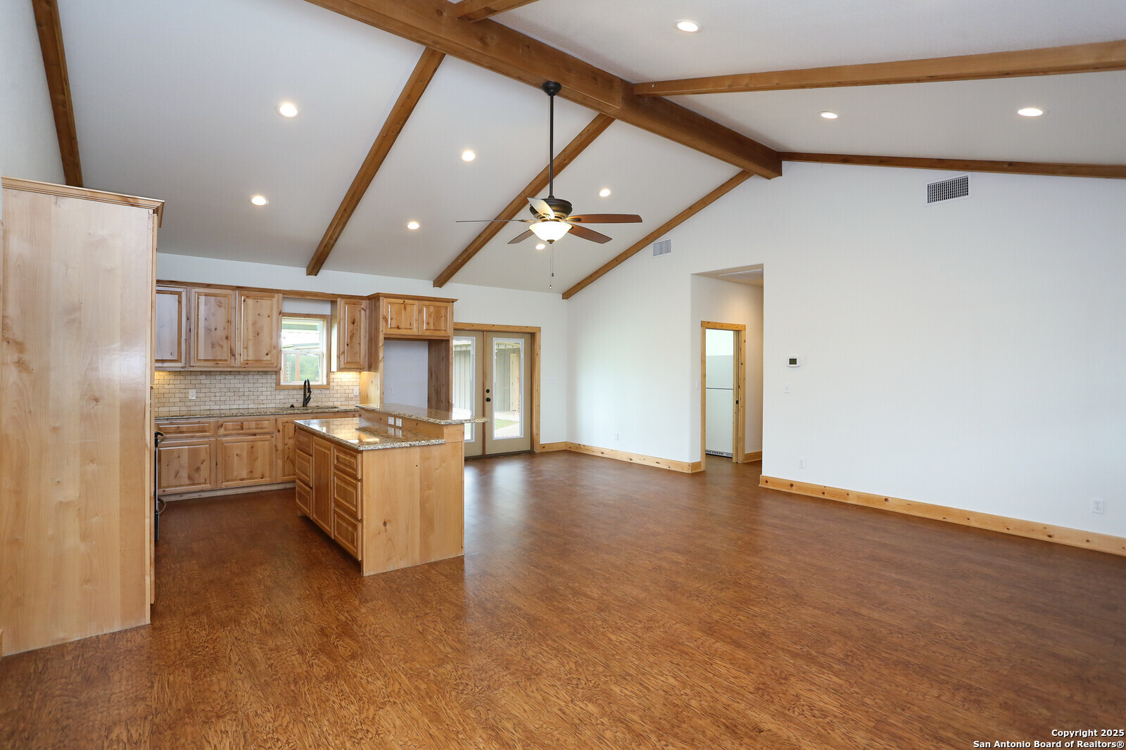 891 Hopkinsville Road Cuero, TX 77954 - Photo 6 of 36 a large kitchen with granite countertop a large counter top appliances and cabinets