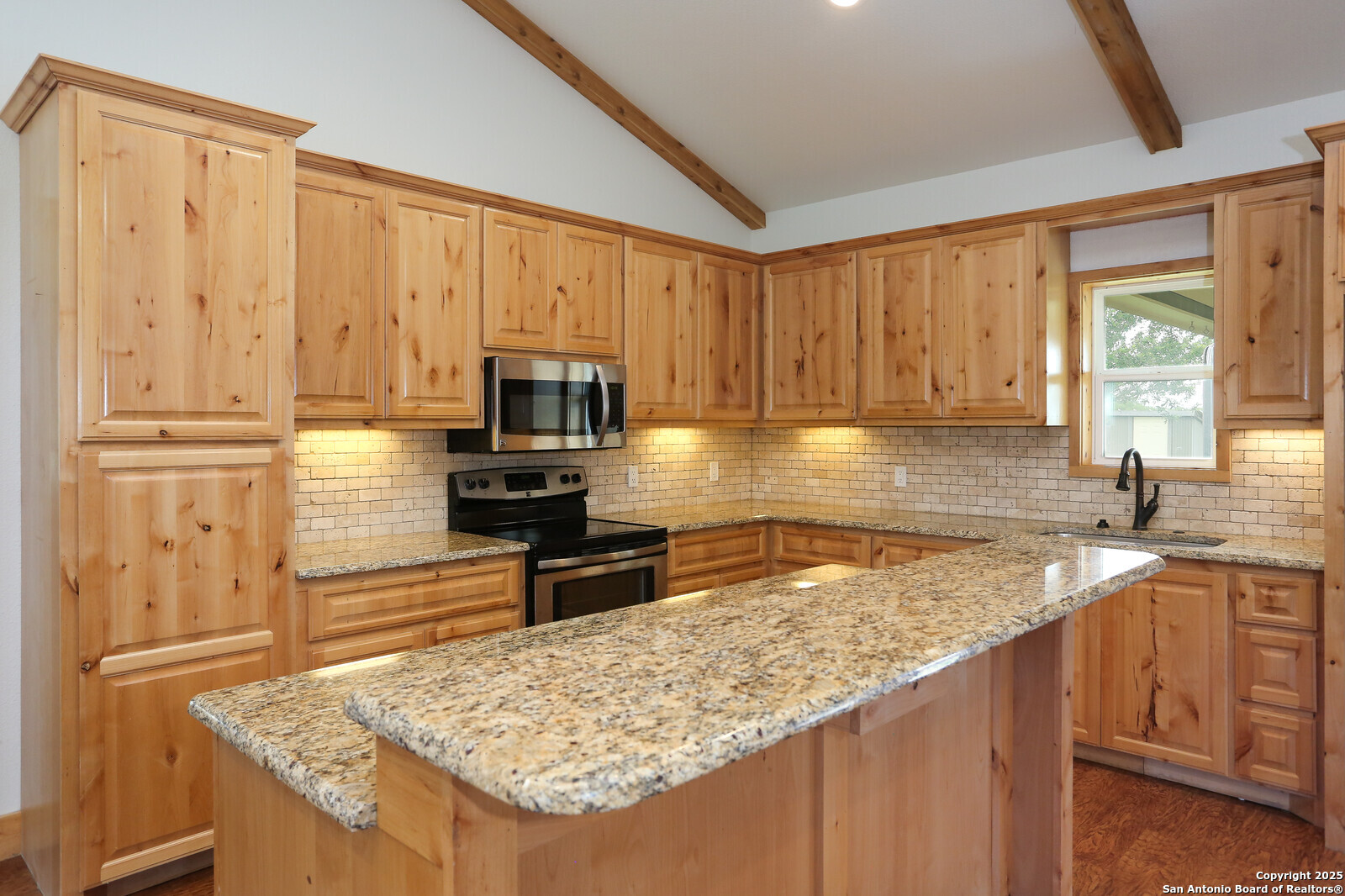 891 Hopkinsville Road Cuero, TX 77954 - Photo 8 of 36 a kitchen with stainless steel appliances granite countertop a sink stove and refrigerator