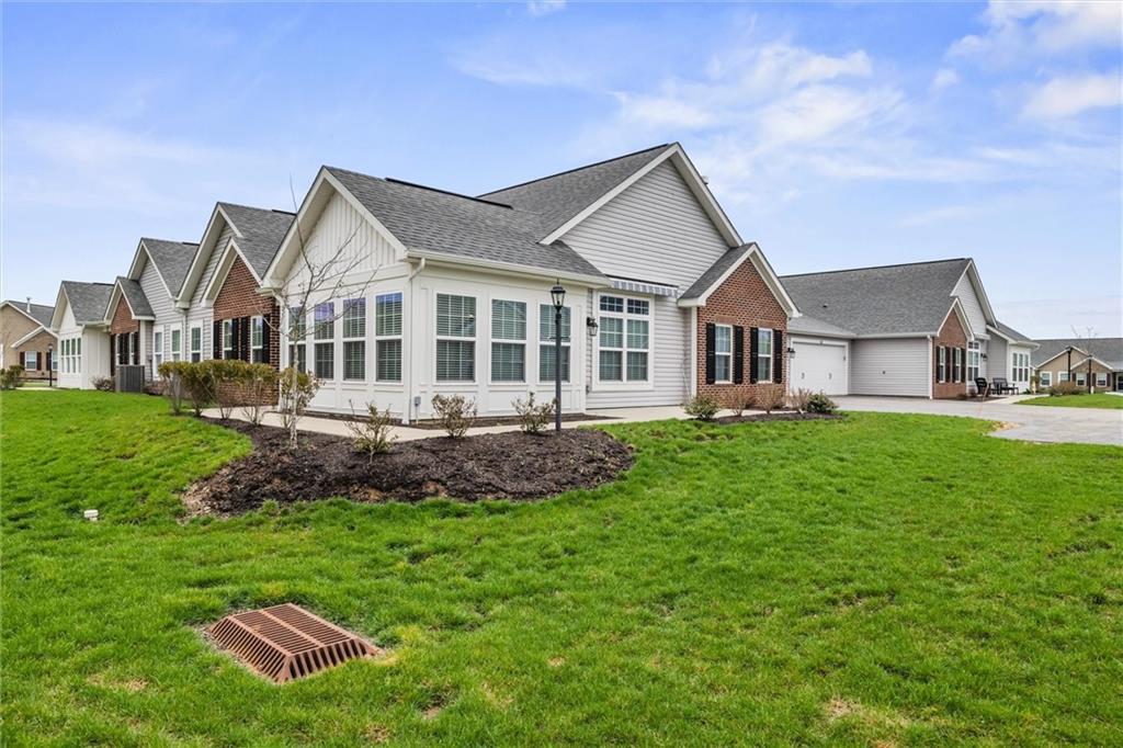 1254 Sandy Rdg Drive Sarver, PA 16055 - Photo 2 of 24 a front view of a house with a garden and trees