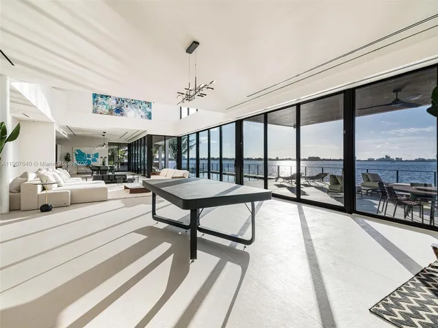 a view of swimming pool with seating area