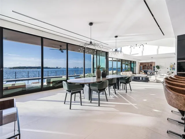 a bed sitting in a spacious bedroom next to a window