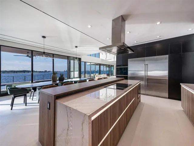 a kitchen with stainless steel appliances granite countertop a sink and cabinets