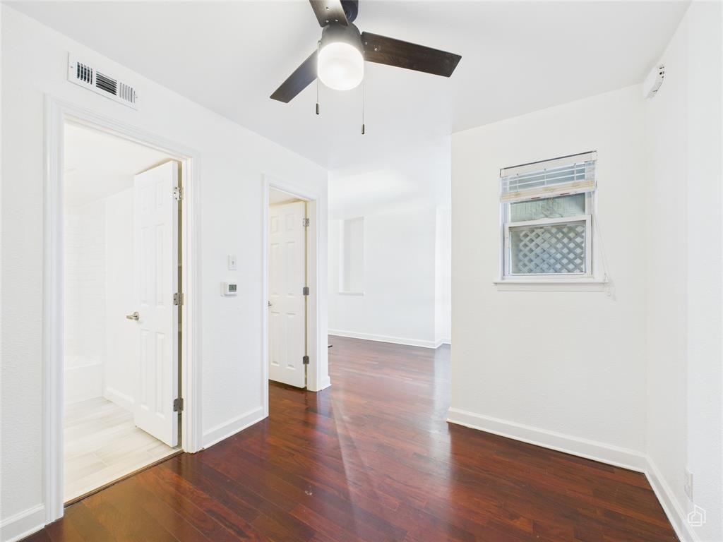 2020 South Congress Avenue, Unit 1209 Austin, TX 78704 - Photo 7 of 16 a view of an empty room with wooden floor