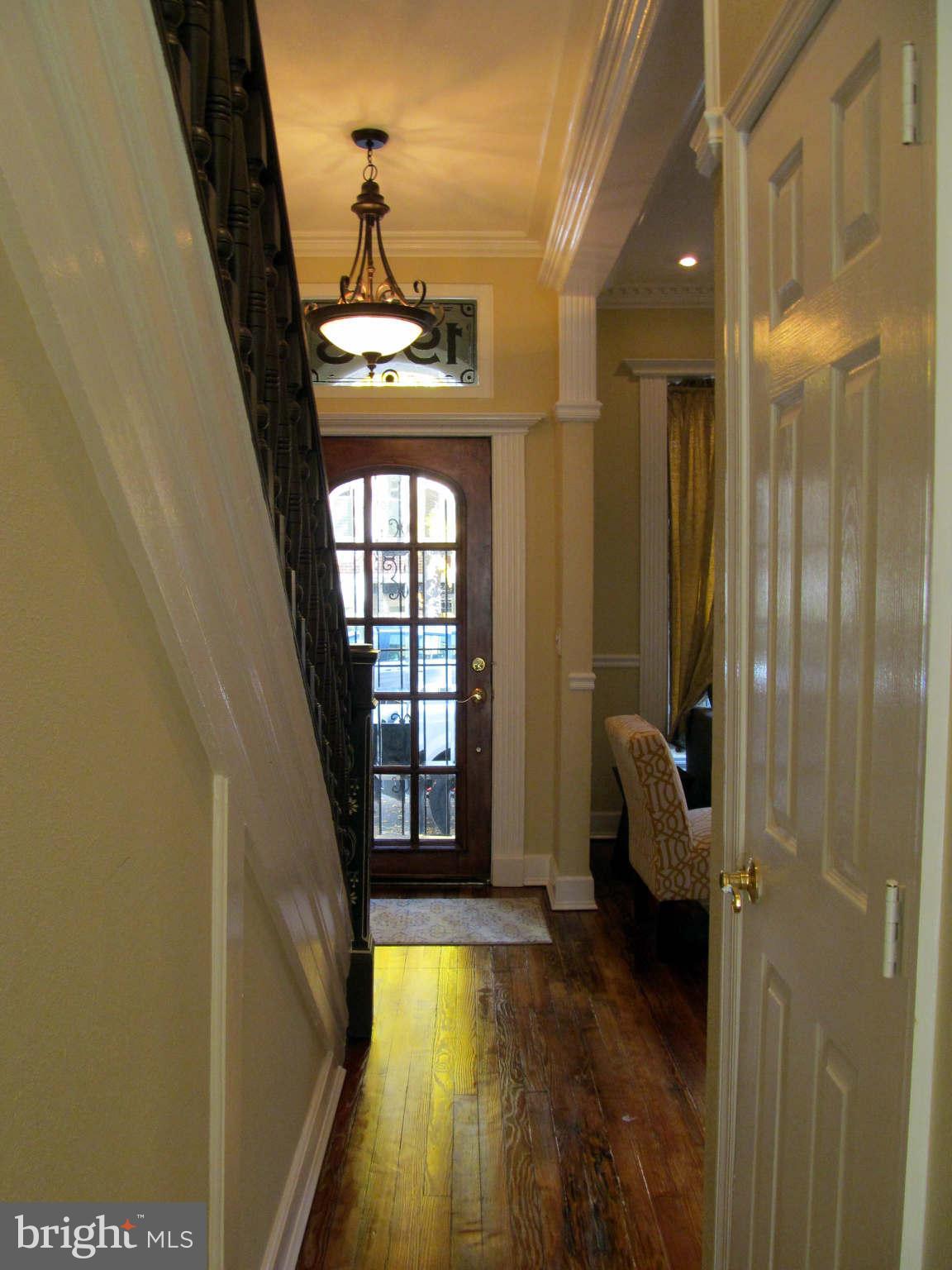 1908 6th Street Northwest Washington, DC 20001 - Photo 14 of 30 a view of a hallway with wooden floor and staircase