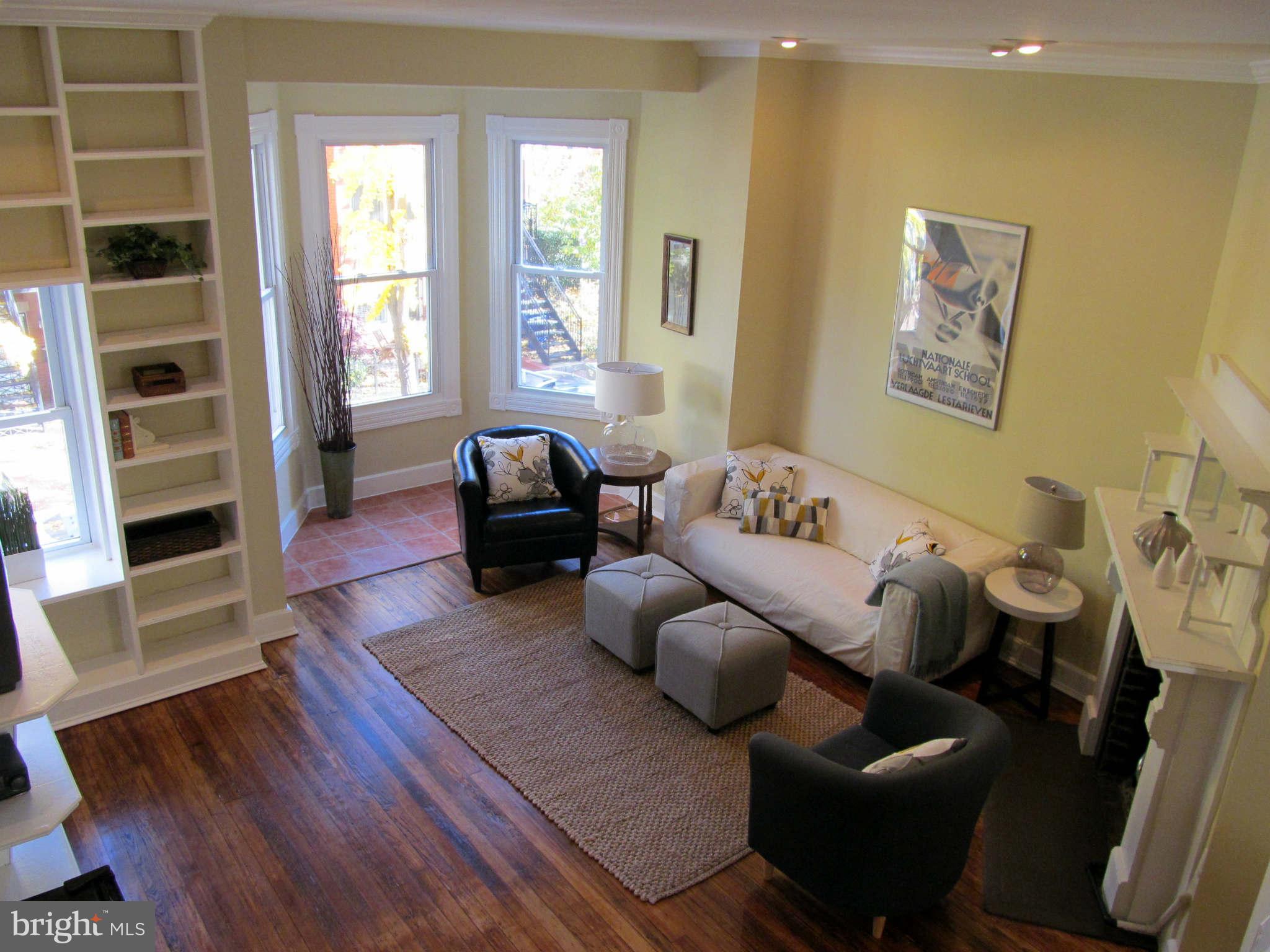 1908 6th Street Northwest Washington, DC 20001 - Photo 16 of 30 a living room with furniture and a window