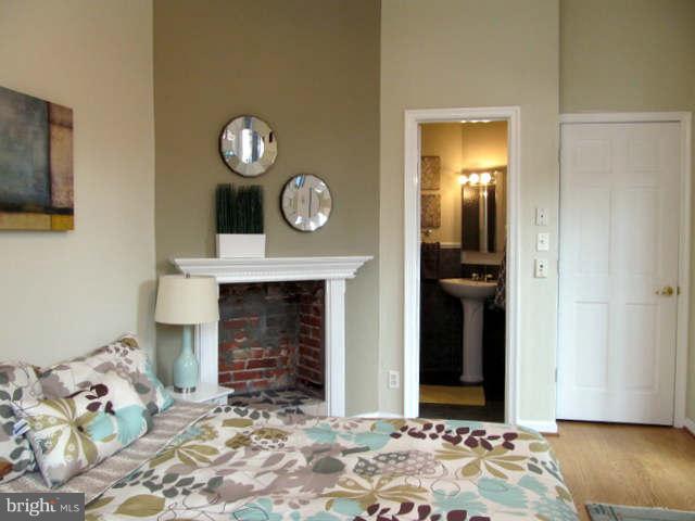 1908 6th Street Northwest Washington, DC 20001 - Photo 19 of 30 a living room with furniture and a fireplace