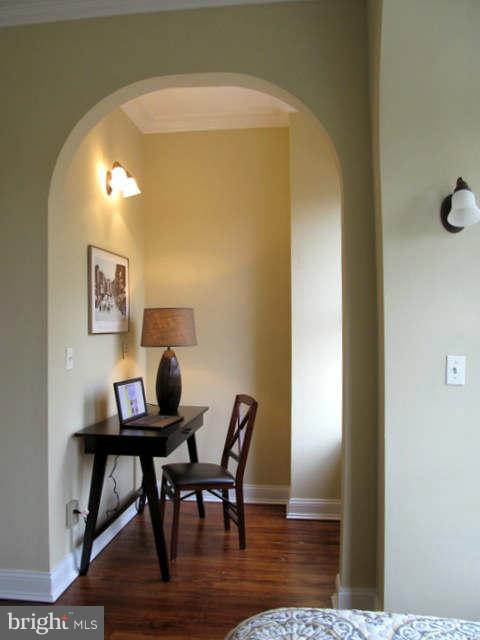 1908 6th Street Northwest Washington, DC 20001 - Photo 24 of 30 a view of a workspace room with wooden floor and table