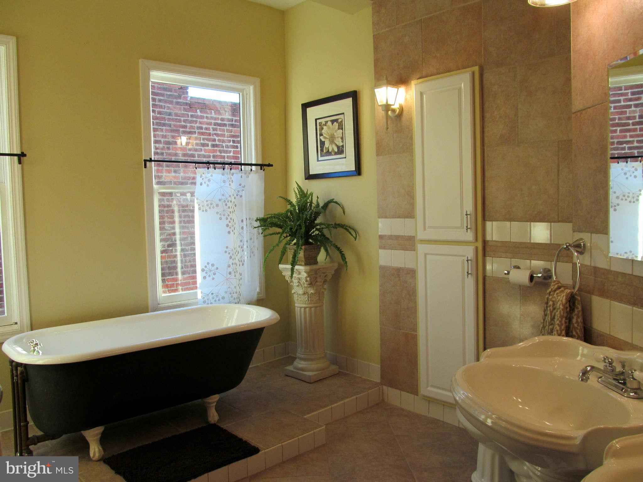 1908 6th Street Northwest Washington, DC 20001 - Photo 26 of 30 a bathroom with a sink and a mirror