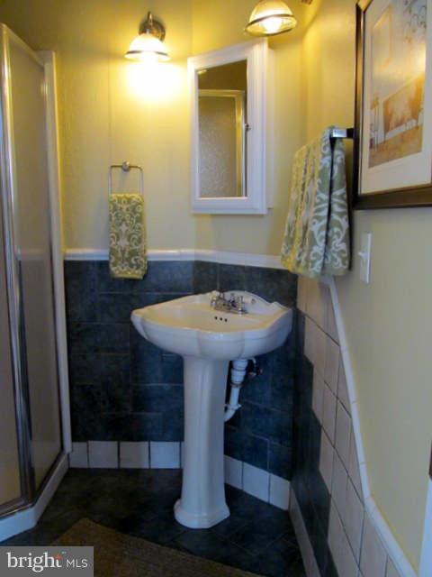 1908 6th Street Northwest Washington, DC 20001 - Photo 30 of 30 a bathroom with a sink and a mirror