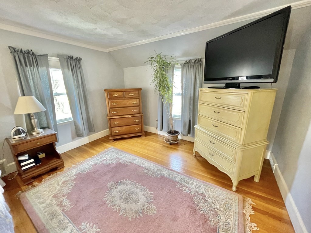 89 Wexford Street Springfield, MA 01118 - Photo 17 of 38 a living room with furniture and a flat screen tv