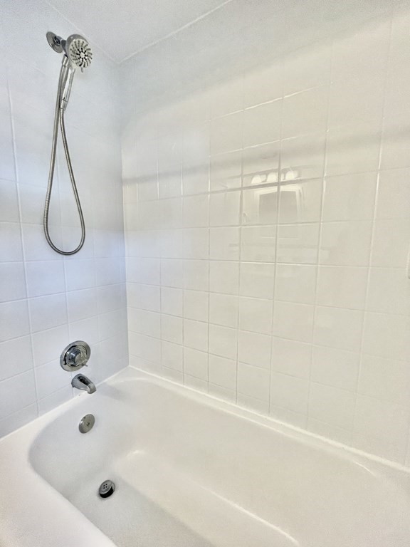 89 Wexford Street Springfield, MA 01118 - Photo 19 of 38 a bathroom with a bath tub with a shower