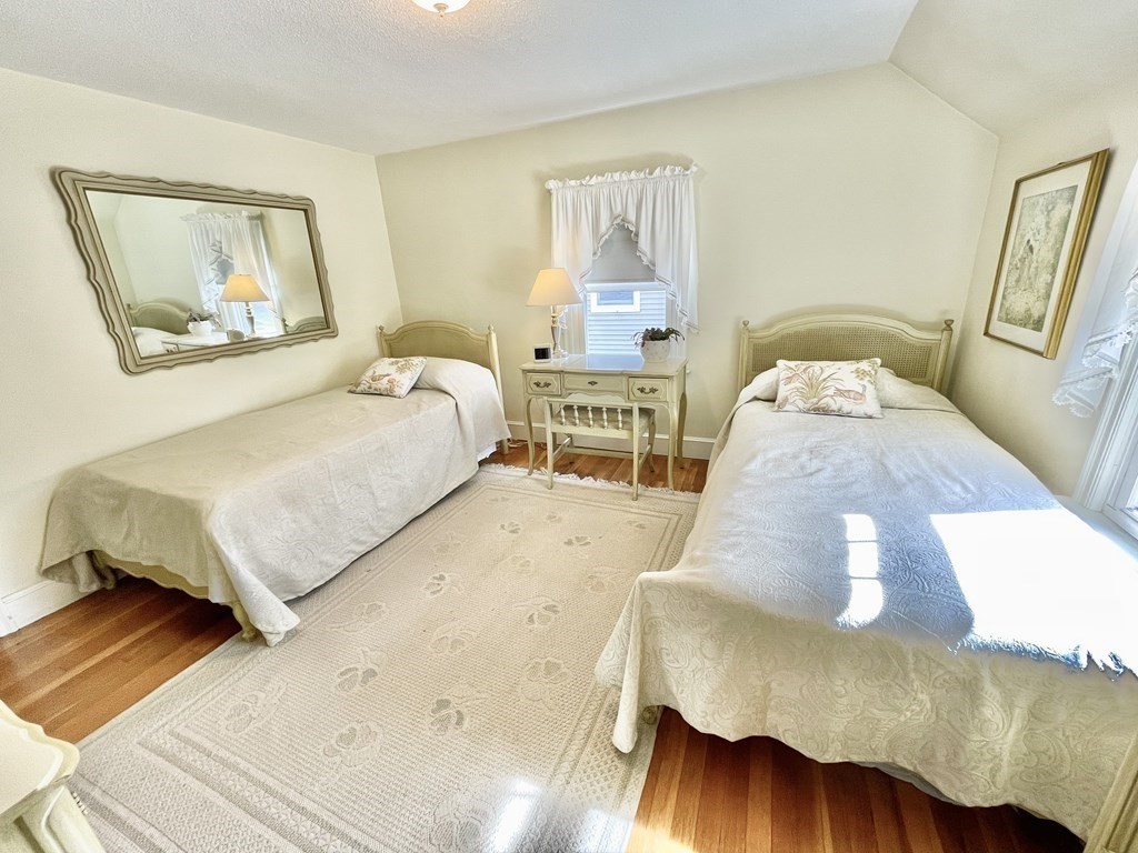 89 Wexford Street Springfield, MA 01118 - Photo 24 of 38 a bedroom with a bed and wooden floor
