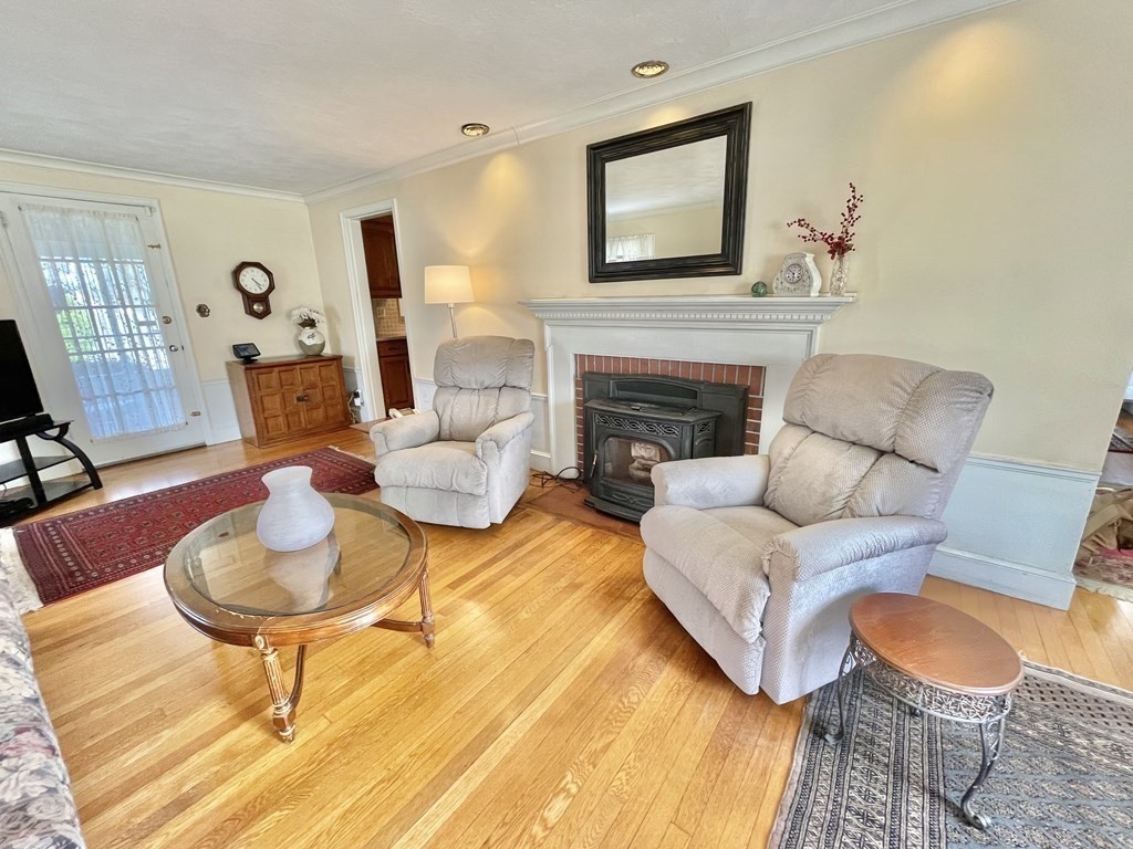 89 Wexford Street Springfield, MA 01118 - Photo 3 of 38 a living room with furniture and a fireplace